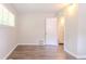 Bedroom with hardwood flooring, neutral paint, and open doorway offering natural light at 1538 Belva Ave, Decatur, GA 30032