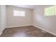 Bedroom with closet, neutral paint, hardwood flooring, and two windows providing natural light at 1538 Belva Ave, Decatur, GA 30032
