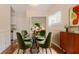 Dining area features a glass table, green chairs, and stylish decor at 1538 Belva Ave, Decatur, GA 30032