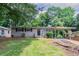 Charming single story home with a carport and well-manicured front yard at 1538 Belva Ave, Decatur, GA 30032