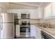 Updated kitchen featuring stainless steel appliances and granite countertops at 1538 Belva Ave, Decatur, GA 30032