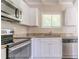 Modern kitchen with stainless steel appliances and beautiful countertops at 1538 Belva Ave, Decatur, GA 30032