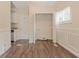 The light and bright laundry room has a modern design with hardwood floors at 1538 Belva Ave, Decatur, GA 30032