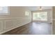 A light-filled living room features hardwood floors and modern wall trim at 1538 Belva Ave, Decatur, GA 30032