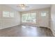 Bright living room featuring hardwood floors, large windows, and stylish decor at 1538 Belva Ave, Decatur, GA 30032