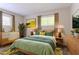 Cozy main bedroom with a queen bed, modern decor, and natural lighting at 1538 Belva Ave, Decatur, GA 30032
