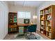 Home office offers a cozy workspace with bookshelves and ample storage at 1538 Belva Ave, Decatur, GA 30032