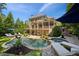 Expansive backyard featuring a pool, spa, and multi-level deck, perfect for outdoor living at 1589 Trentwood Ne Pl, Brookhaven, GA 30319