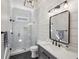 Modern bathroom with sleek glass shower, stylish vanity, and neutral color scheme for a spa-like experience at 1589 Trentwood Ne Pl, Brookhaven, GA 30319
