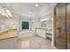 Bright bathroom with double vanity, soaking tub, and separate glass shower, offering ample space and luxury at 1589 Trentwood Ne Pl, Brookhaven, GA 30319