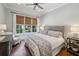 Serene bedroom with neutral color palette, large window, and hardwood floors offering a peaceful retreat at 1589 Trentwood Ne Pl, Brookhaven, GA 30319