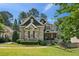 Beautiful two-story brick and stone home with lush landscaping and a well-manicured lawn at 1589 Trentwood Ne Pl, Brookhaven, GA 30319
