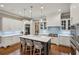 Bright kitchen featuring a center island, stainless appliances, and stylish pendant lighting at 1589 Trentwood Ne Pl, Brookhaven, GA 30319