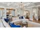 Open-concept living room with stone fireplace, coffered ceiling and views into the kitchen, perfect for entertaining at 1589 Trentwood Ne Pl, Brookhaven, GA 30319