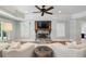 Cozy living room with a stone fireplace, recessed lighting, and plush seating for relaxation at 1589 Trentwood Ne Pl, Brookhaven, GA 30319