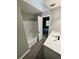 Bathroom boasts modern vanity with stunning white countertop, contemporary fixtures, and tub with shower at 168 Park Ln, Dallas, GA 30157