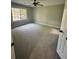 Bedroom with new carpet, ceiling fan, and large window for ample natural light at 168 Park Ln, Dallas, GA 30157