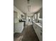 Open concept kitchen with white cabinets, stainless steel appliances, and modern finishes at 168 Park Ln, Dallas, GA 30157