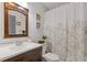 Bathroom features a vanity with framed mirror and stylish shower curtain at 2728 Mcafee Rd, Decatur, GA 30032
