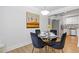 Eat-in dining area features a modern light fixture and seating for four at 2728 Mcafee Rd, Decatur, GA 30032