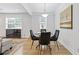 Modern dining area with a round table, velvet chairs, and natural light at 2728 Mcafee Rd, Decatur, GA 30032