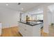 Spacious island with granite countertops offers additional prep space and storage at 2728 Mcafee Rd, Decatur, GA 30032