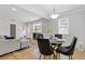 Cozy living area flowing into a dining space, featuring hardwood floors and neutral tones at 2728 Mcafee Rd, Decatur, GA 30032