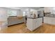 Open concept living space flows from kitchen island to living area at 2728 Mcafee Rd, Decatur, GA 30032