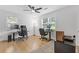 Bright home office with hardwood floors, a ceiling fan and dual desk and computer setup at 2728 Mcafee Rd, Decatur, GA 30032