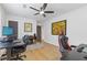A home office with hardwood floors, a ceiling fan, and computer station near artwork at 2728 Mcafee Rd, Decatur, GA 30032