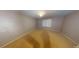 Bedroom with cream walls, a small window, and neutral carpeted flooring at 33 Powder Dr, Dallas, GA 30157