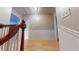 Upstairs hallway with wooden floors and white trim at 33 Powder Dr, Dallas, GA 30157