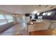 Updated kitchen with dark cabinets, granite countertops, breakfast bar, and modern appliances at 33 Powder Dr, Dallas, GA 30157