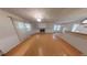 Bright living room with fireplace and hardwood flooring with an adjacent dining area at 33 Powder Dr, Dallas, GA 30157