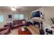 Inviting living room featuring a fireplace, large windows, and comfortable leather seating at 33 Powder Dr, Dallas, GA 30157