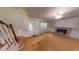 Spacious living room with hardwood floors, fireplace, and staircase to the upper level at 33 Powder Dr, Dallas, GA 30157