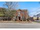 Charming brick multi-Gathering home featuring a traditional design with a manicured front yard and mature trees at 733 Frederica Ne St # 7, Atlanta, GA 30306
