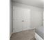 Spacious bedroom with a large closet, soft carpeting, and a comfortable bed partially shown at 804 Whittington Sw Pkwy, Marietta, GA 30060