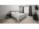 Neutral-toned bedroom with plush carpet, large window, and sleek, modern furnishings at 804 Whittington Sw Pkwy, Marietta, GA 30060