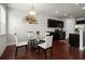 Bright dining area features a glass table, four chairs, and decorative wall fan near the kitchen at 804 Whittington Sw Pkwy, Marietta, GA 30060