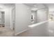 Bright hallway with neutral colors and plush carpeting leads to various rooms in the home at 804 Whittington Sw Pkwy, Marietta, GA 30060