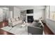 Cozy living room with fireplace, modern decor, and plenty of natural light at 804 Whittington Sw Pkwy, Marietta, GA 30060
