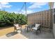 Cozy patio space with cushioned chairs, small table, and fenced privacy at 804 Whittington Sw Pkwy, Marietta, GA 30060