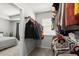 Well-organized walk-in closet with clothing racks, shelves, and view into the bedroom at 804 Whittington Sw Pkwy, Marietta, GA 30060