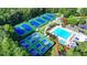 Aerial view showcases tennis courts, a sparkling swimming pool, and meticulously landscaped community amenities at 1635 Lake Heights Cir, Dacula, GA 30019