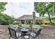 Spacious backyard with outdoor seating surrounding a fire pit and view of the house at 1635 Lake Heights Cir, Dacula, GA 30019