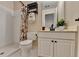 Cozy bathroom with shower, toilet, vanity, and floral shower curtain at 1635 Lake Heights Cir, Dacula, GA 30019