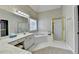 Elegant bathroom features a walk-in shower, soaking tub, dual sinks, and vanity at 1635 Lake Heights Cir, Dacula, GA 30019