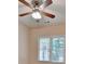 Bedroom features a ceiling fan and a bright window at 1635 Lake Heights Cir, Dacula, GA 30019