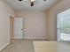Bedroom with neutral paint, carpeted floors, large window, and ample sunlight at 1635 Lake Heights Cir, Dacula, GA 30019
